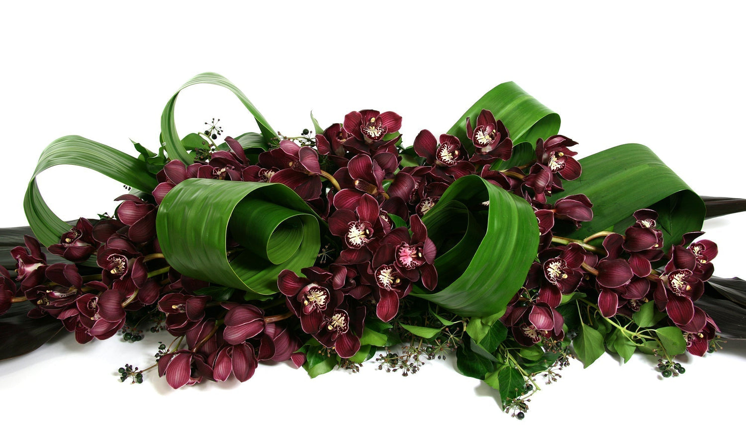 Funeral Flower display using orchids in Burgundy tones
