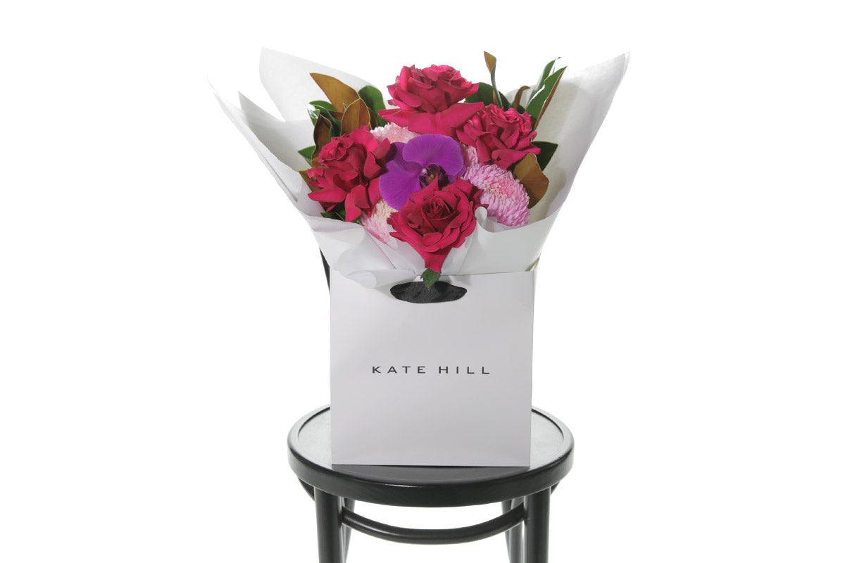 Kate Hill Flowers – medium hot-pink birthday bouquet featuring roses, hydrangeas and magenta orchids hand-tied.