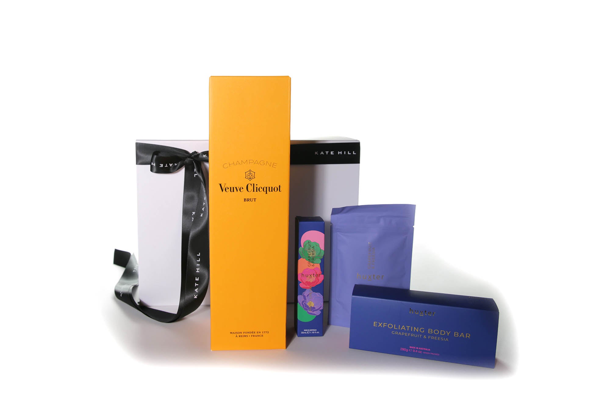 Gift box hamper featuring a French Champagne and body care products.