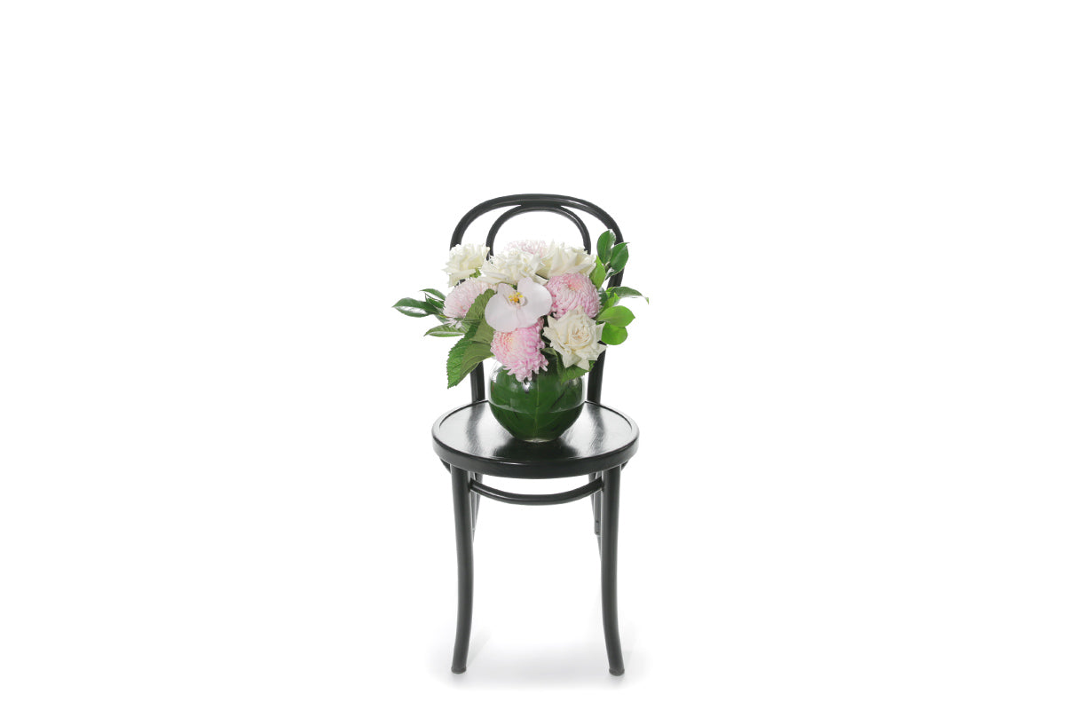 Kate Hill Flowers – pastel ball-vase birthday design with blush chrysanthemums, white roses, orchids and lush foliage.