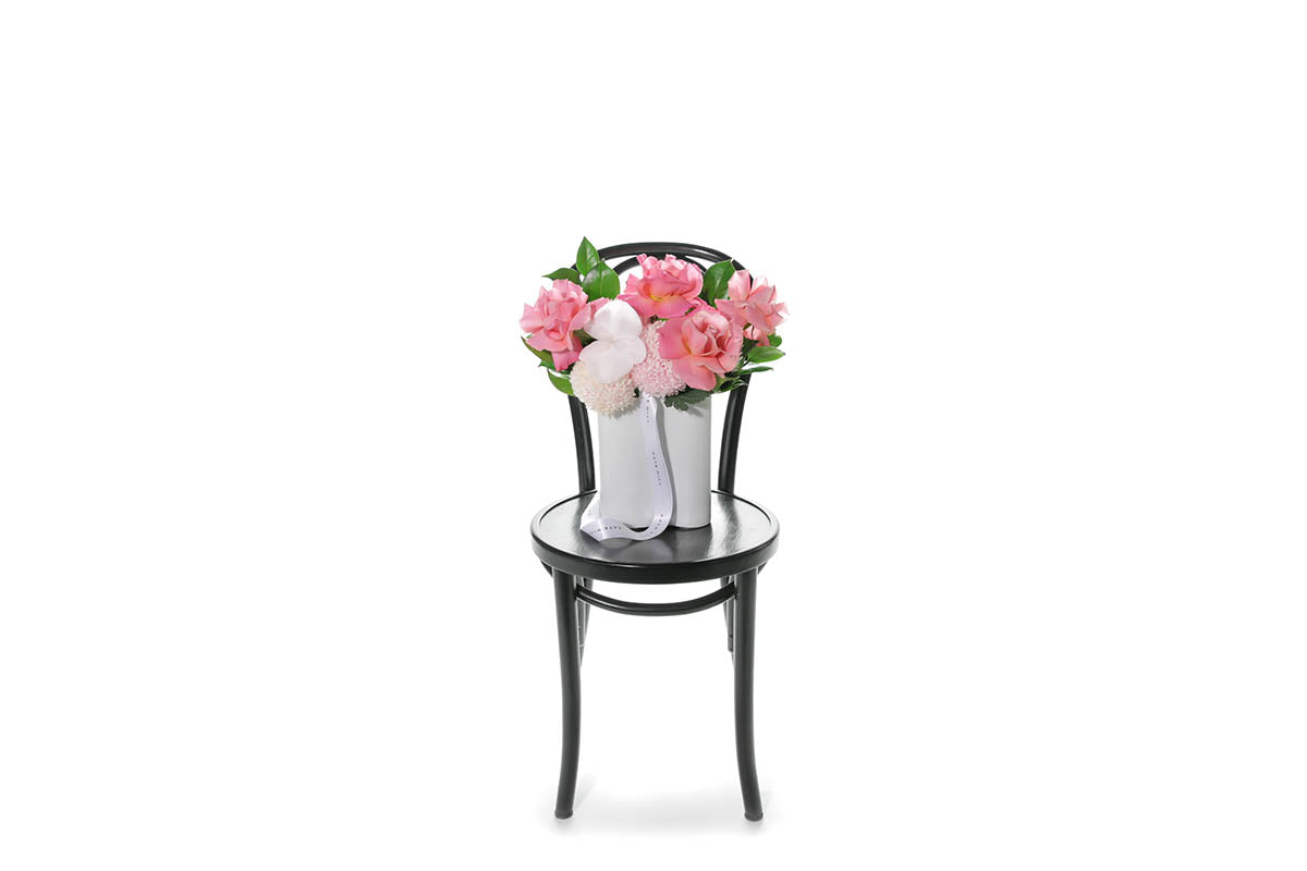 Kate Hill Flowers – soft-pink birthday vase with chrysanthemums, blush roses and orchids in a white wave ceramic.