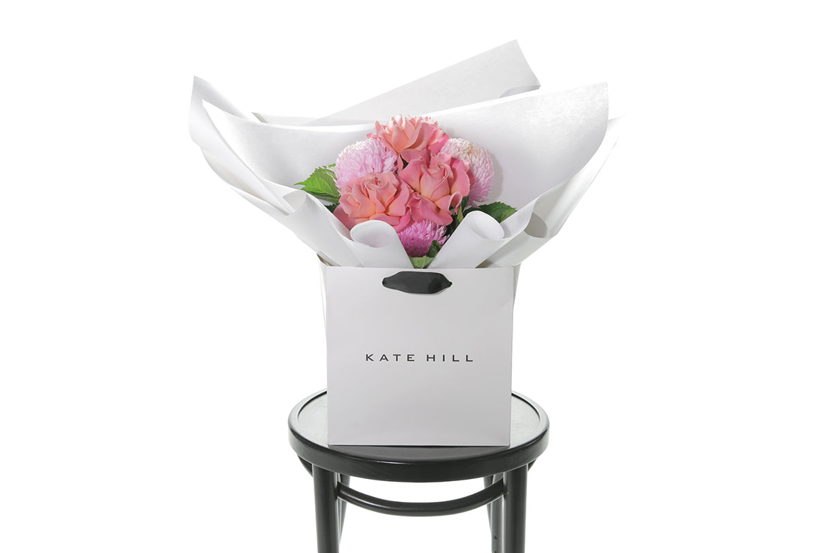 Kate Hill Flowers – petite blush and watermelon birthday posy with roses, hydrangeas and foliage hand-tied.
