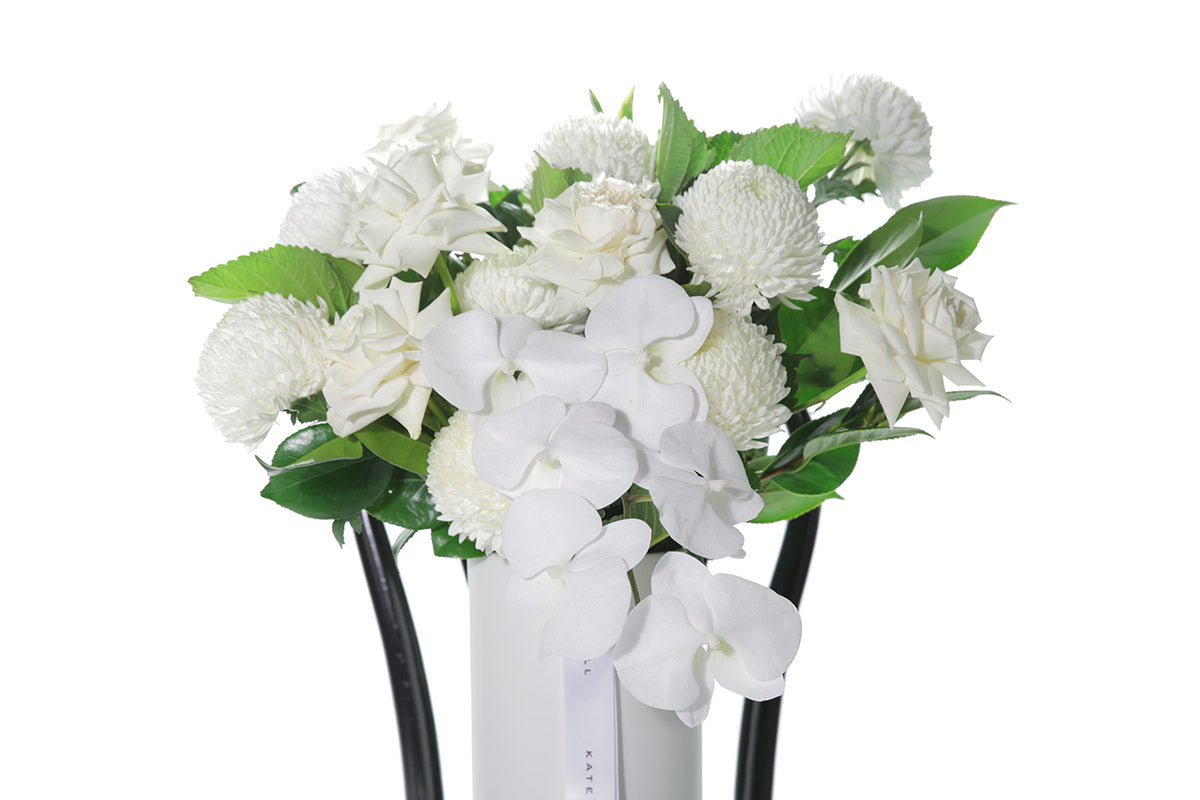 Kate Hill Flowers – large white and green ceramic vase with roses, chrysanthemums and orchids.