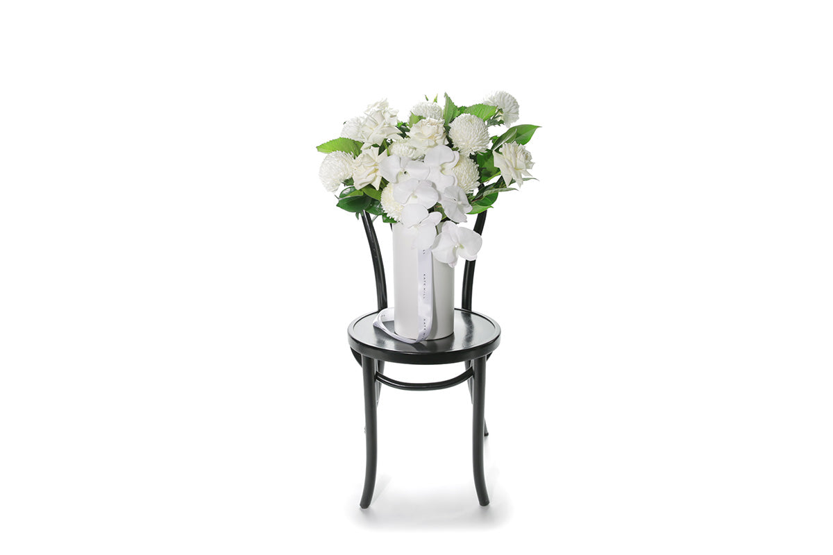 Kate Hill Flowers – large white and green ceramic vase with roses, chrysanthemums and orchids.