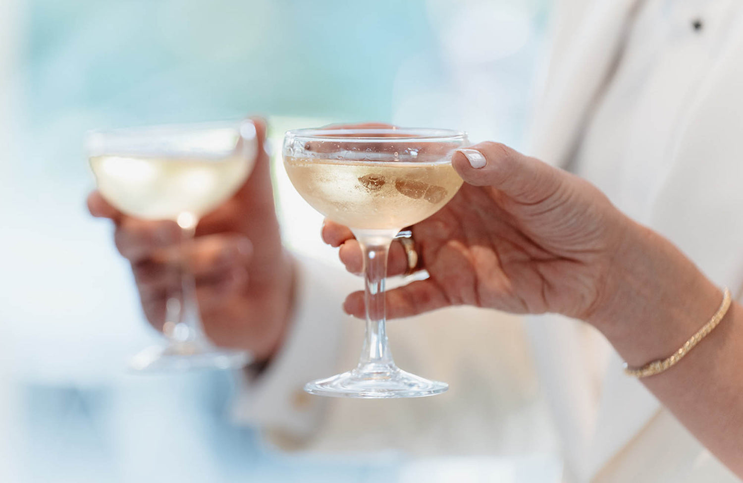Two people toasting glasses at a Melbourne wedding
