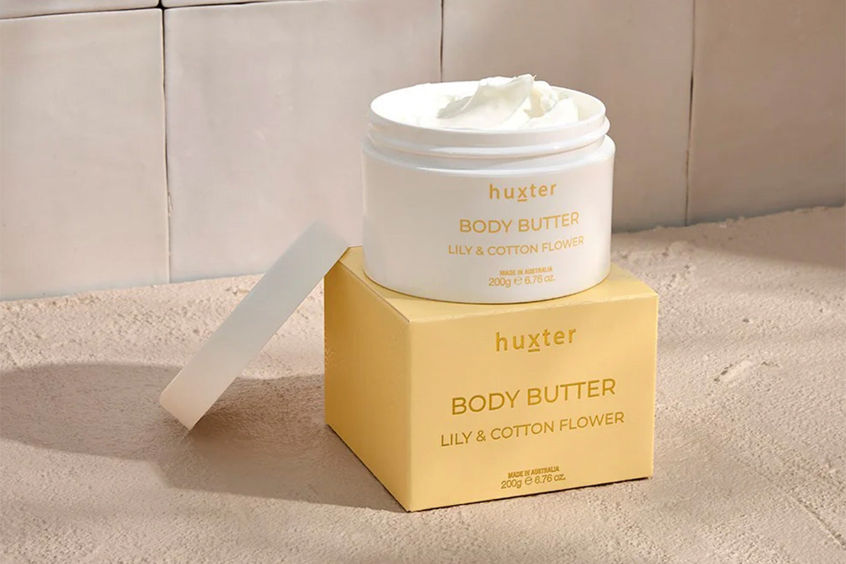 Huxster Body Butter Lily & Cotton shown in bathroom setting