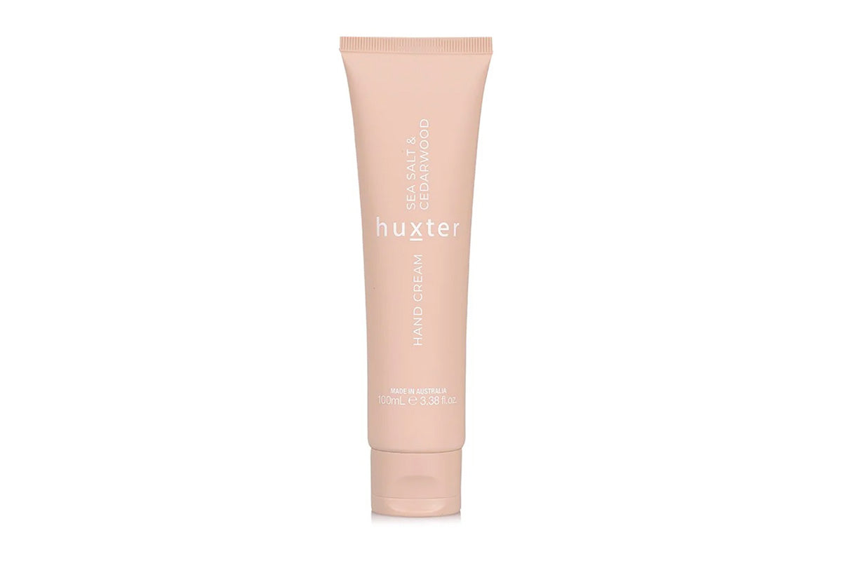 Huxster hand cream tube on a white background.