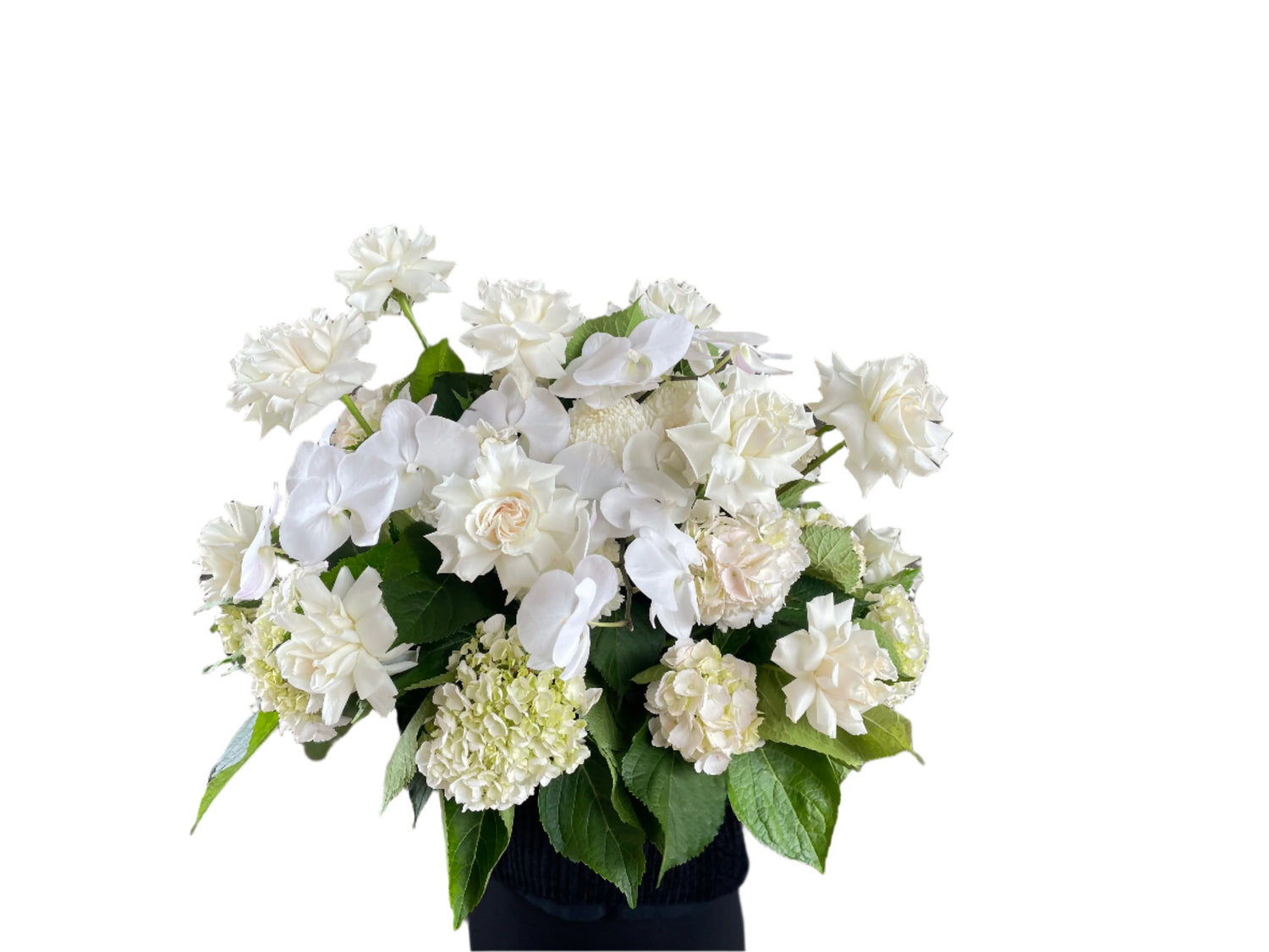 Wide image of Large white and green casket tribute design, being held by a florist wearing black and standing in front of a white wall.