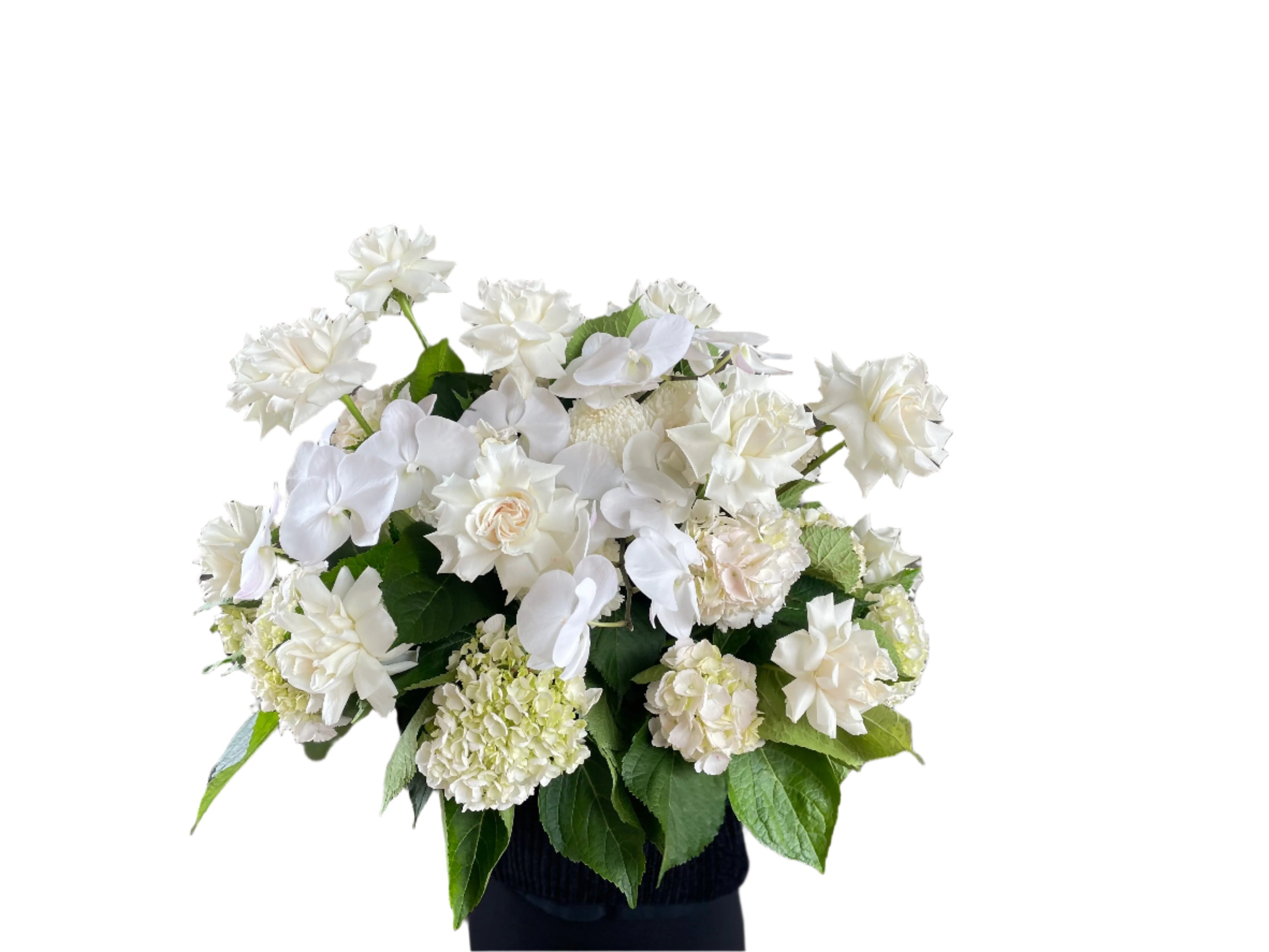 Wide image of Large white and green casket tribute design, being held by a florist wearing black and standing in front of a white wall.