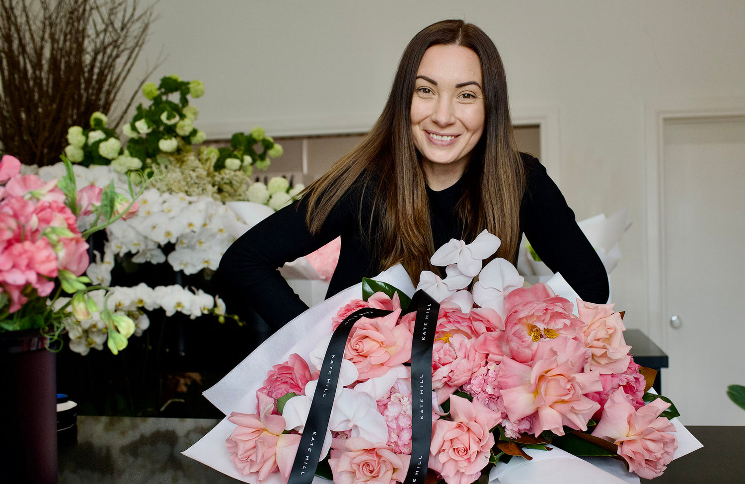 Melbourne Florist Kate Hill with a flower bouquet ready for same day Melbourne flower delivery