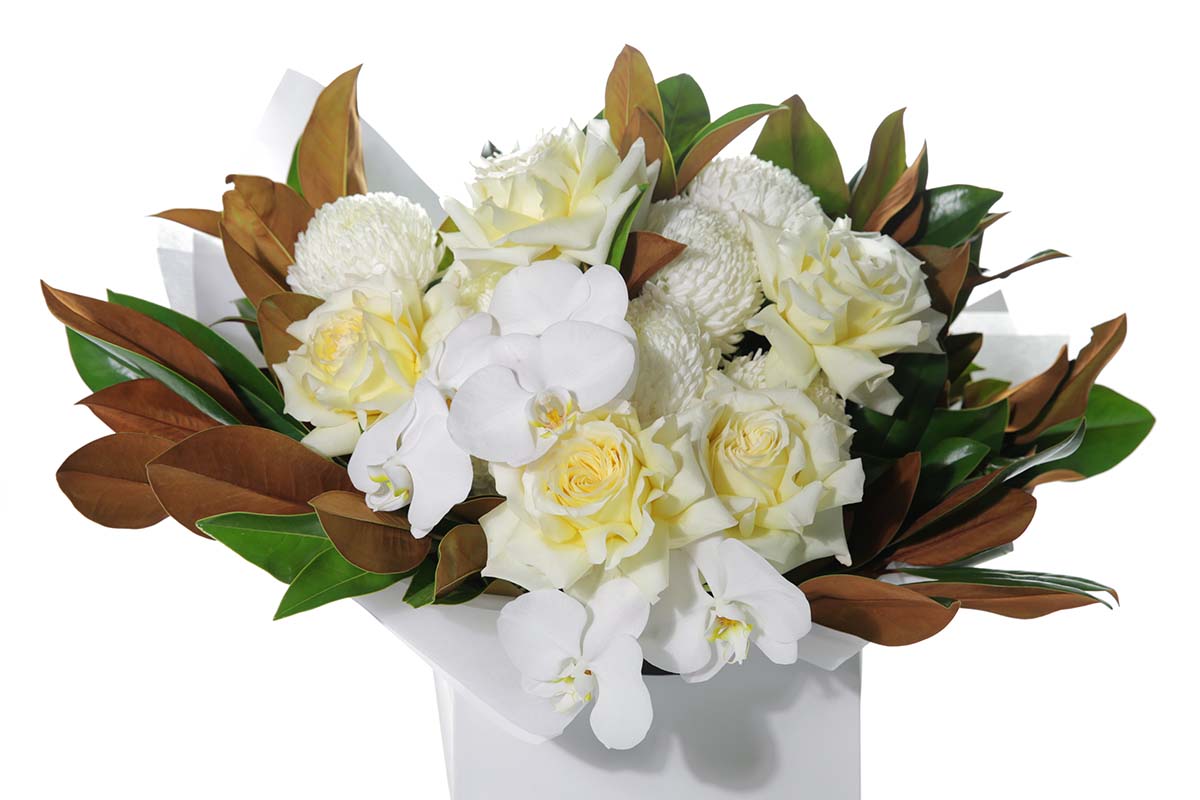 Kate Hill Flowers – large lemon and white thank-you bouquet of roses, chrysanthemums, orchids and magnolia foliage, hand-tied.