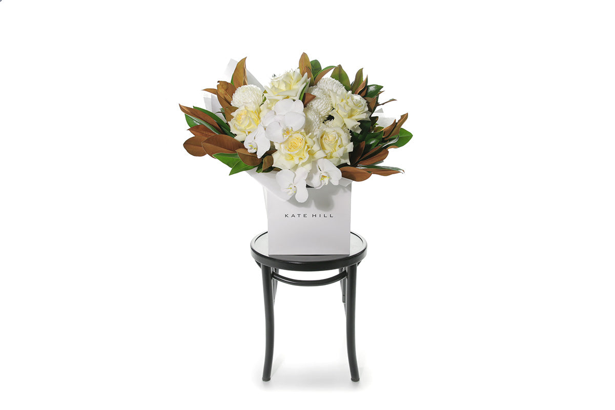 Kate Hill Flowers – large lemon and white thank-you bouquet of roses, chrysanthemums, orchids and magnolia foliage, hand-tied.