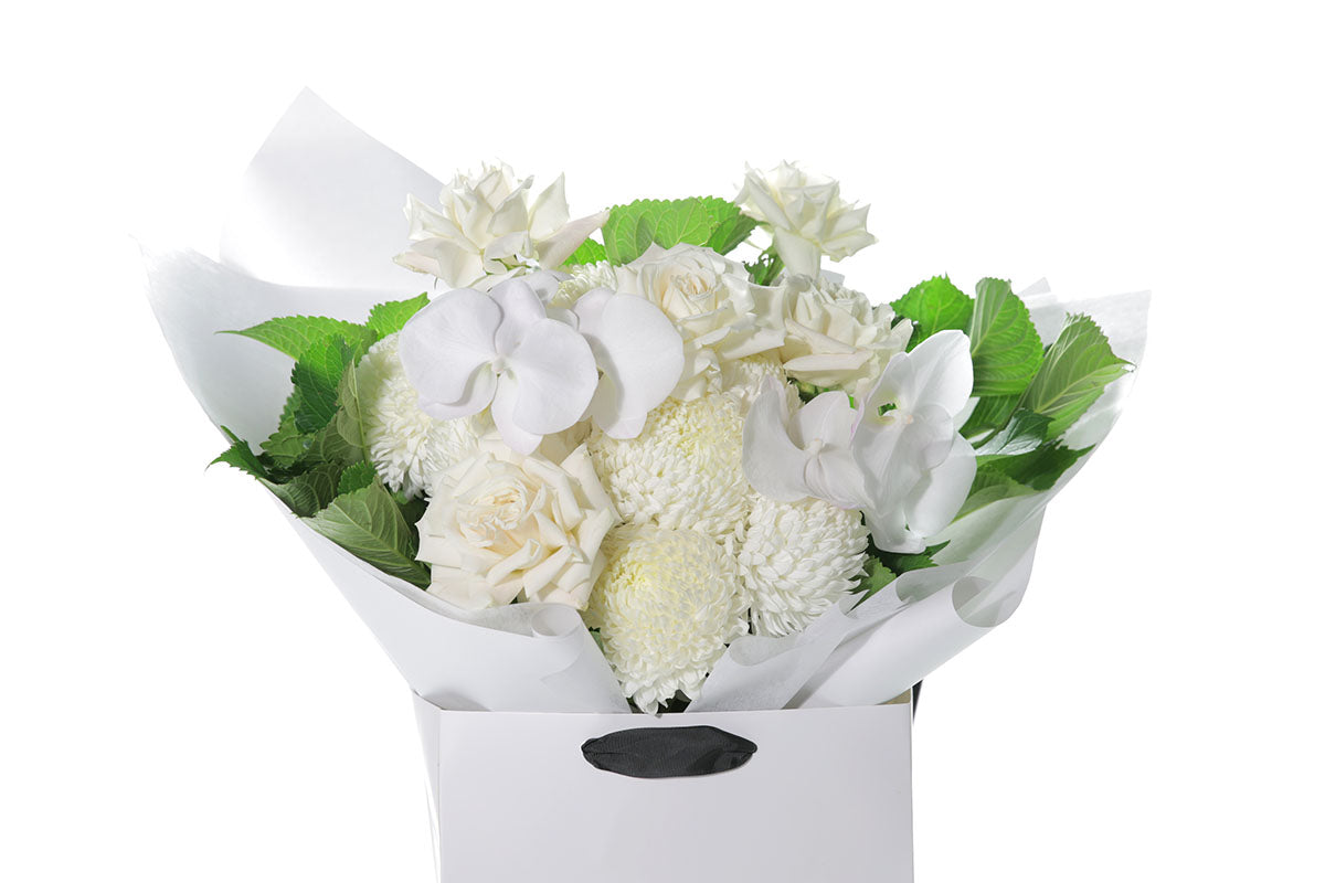 Kate Hill Flowers – large white sympathy bouquet of roses, chrysanthemums and greenery hand-tied.
