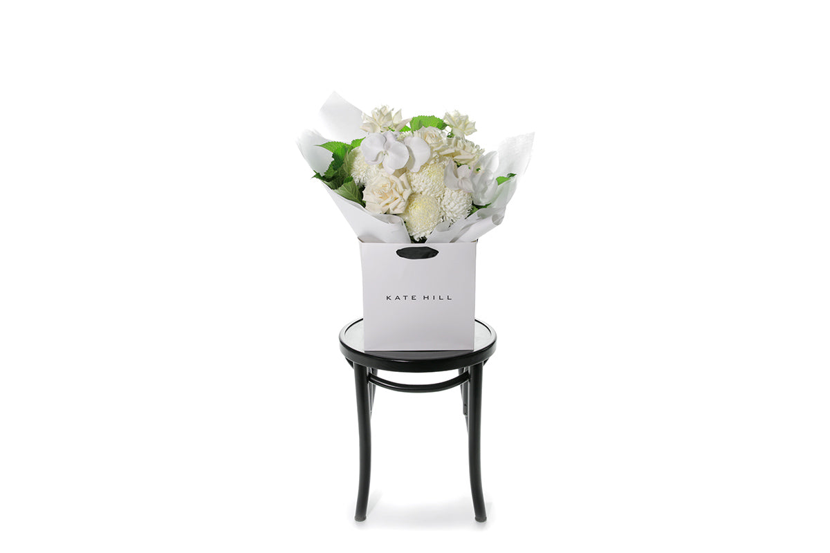 Kate Hill Flowers – large white sympathy bouquet of roses, chrysanthemums and greenery hand-tied.