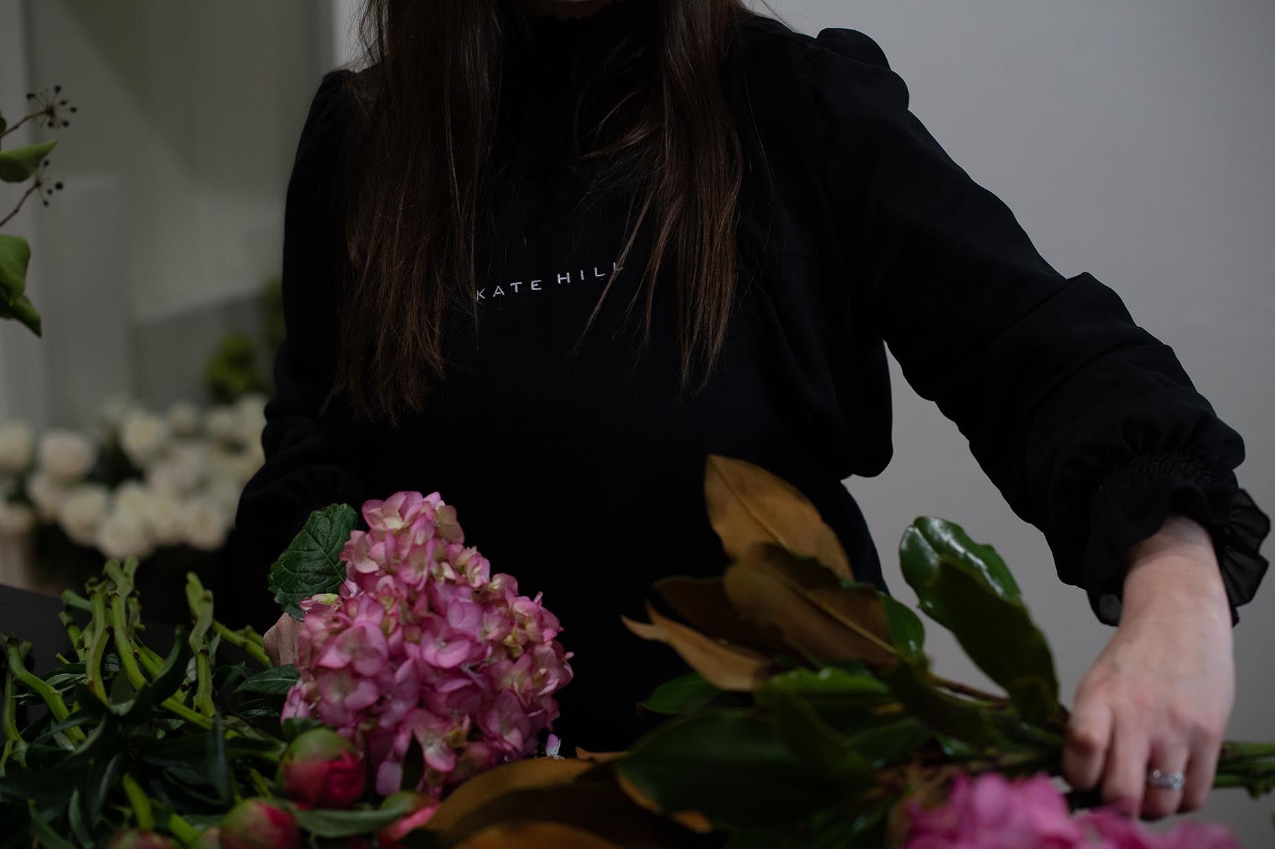 Florist in Melbourne arranging flowers