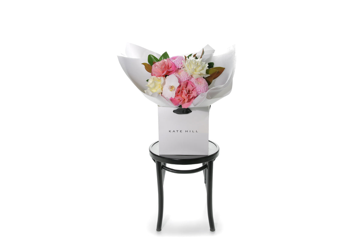 Kate Hill Flowers – medium mixed-pastel birthday bouquet of roses, chrysanthemums, orchids and foliage, hand-tied.