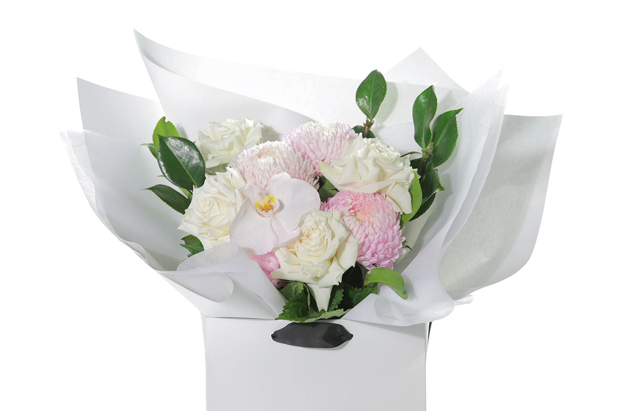 Kate Hill Flowers – medium white sympathy bouquet of roses, chrysanthemums and greenery, hand-tied.