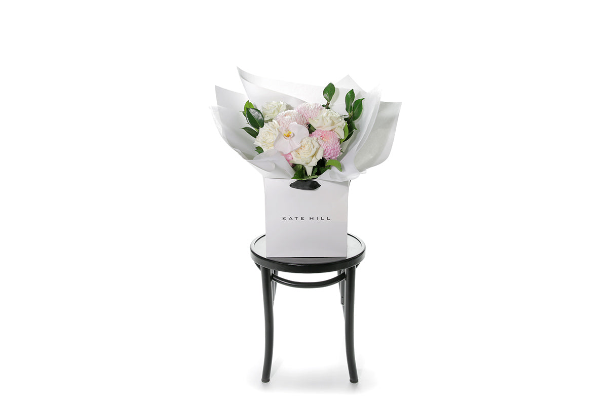 Kate Hill Flowers – medium white sympathy bouquet of roses, chrysanthemums and greenery, hand-tied.