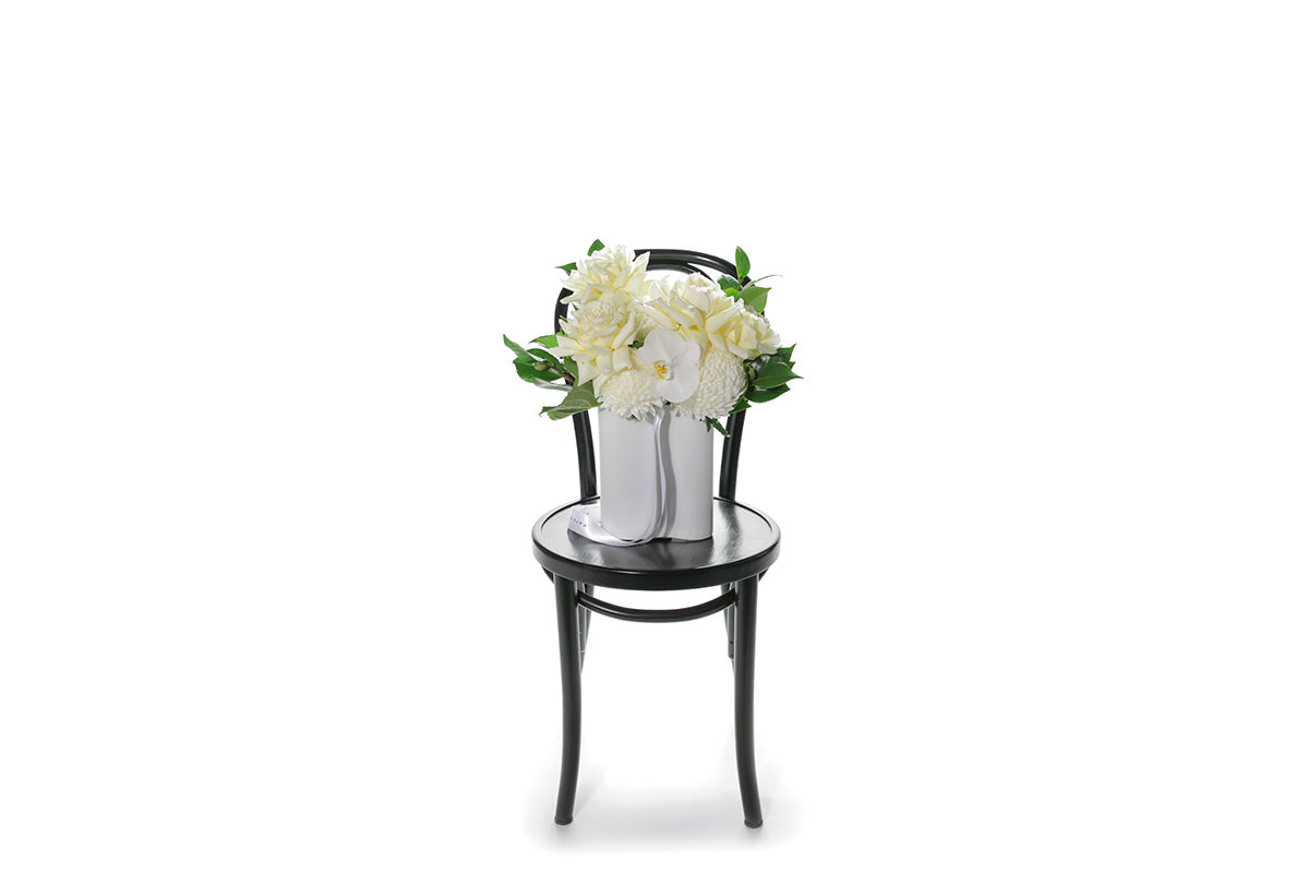 Kate Hill Flowers – white and lemon congratulations vase with roses, chrysanthemums, orchids and foliage in a white wave ceramic.