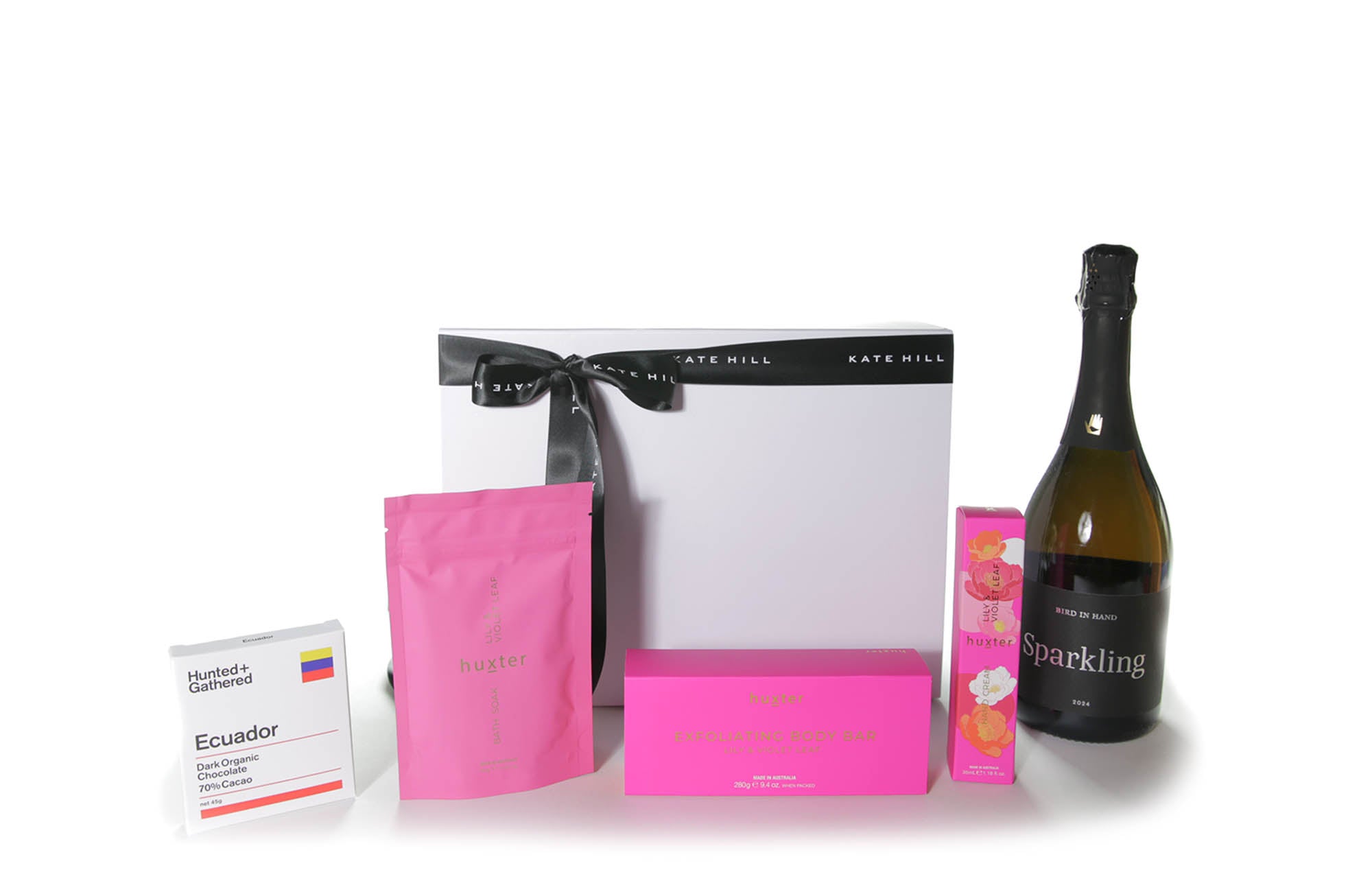Gift box hamper with chocolate, body care products and a bottle of sparkling Australian wine.