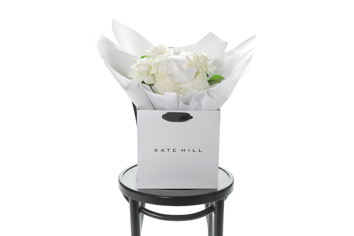 Kate Hill Flowers – medium birthday bouquet of white roses, hydrangeas, orchids and seasonal blooms hand-tied.