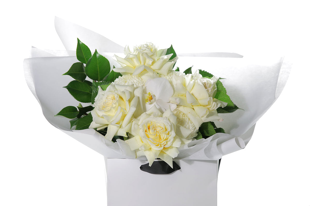 Kate Hill Flowers – medium lemon and white birthday bouquet with candlelight roses, hydrangeas, orchids and foliage hand-tied.