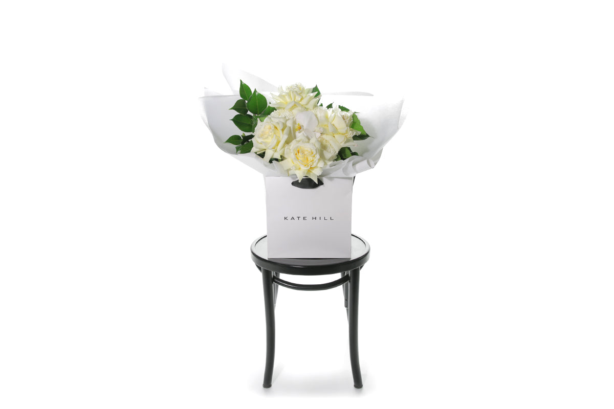 Kate Hill Flowers – medium lemon and white birthday bouquet with candlelight roses, hydrangeas, orchids and foliage hand-tied.