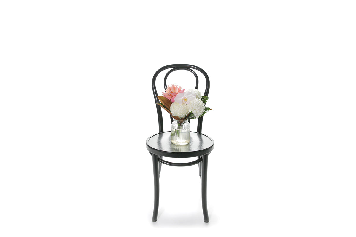 Kate Hill Flowers – small ribbed jar vase with blush orchid, white disbud, pink rose and magnolia foliage.