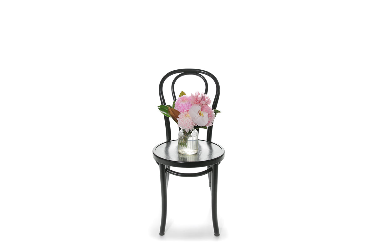 Kate Hill Flowers – small soft-pink birthday vase with chrysanthemum, rose, orchid and foliage in a ribbed jar.