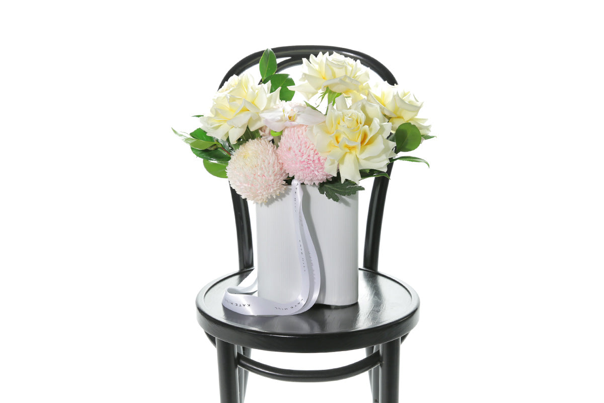 Kate Hill Flowers – pastel wave vase with pink chrysanthemums, lemon roses and blush orchids.