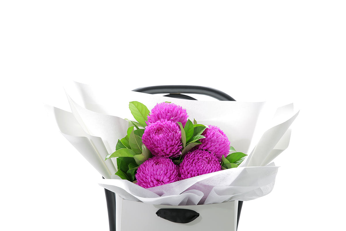 Close-up of ARIA small bouquet with hot pink chrysanthemum disbuds