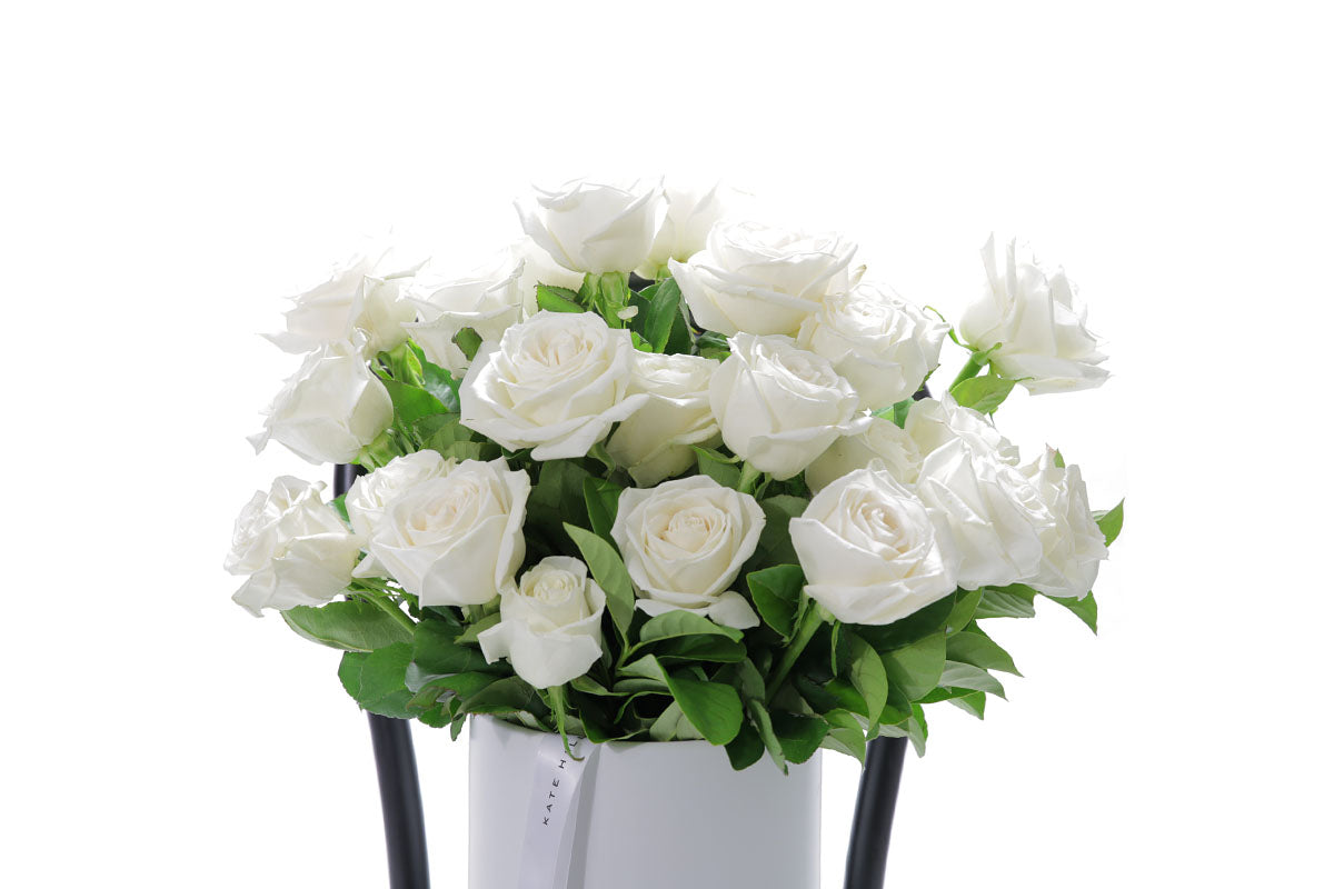 Close-up of BLANCA ceramic design with white roses