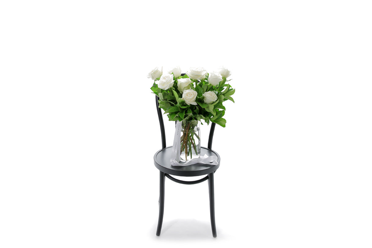 BLANCA 20 white roses in a tapered glass vase lined with monsteria