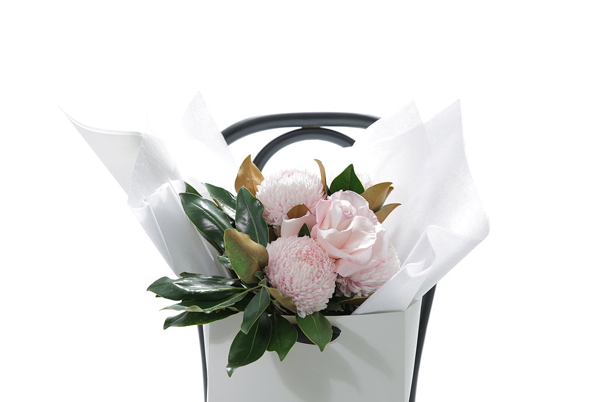 Close-up of CHLOE small bouquet with soft blush and pink seasonal blooms