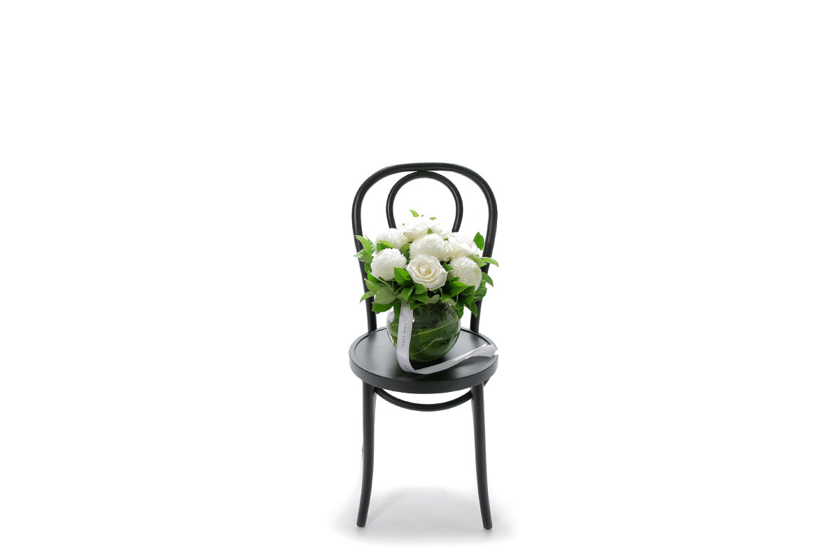 ELISE white flowers in a 20cm glass ball vase