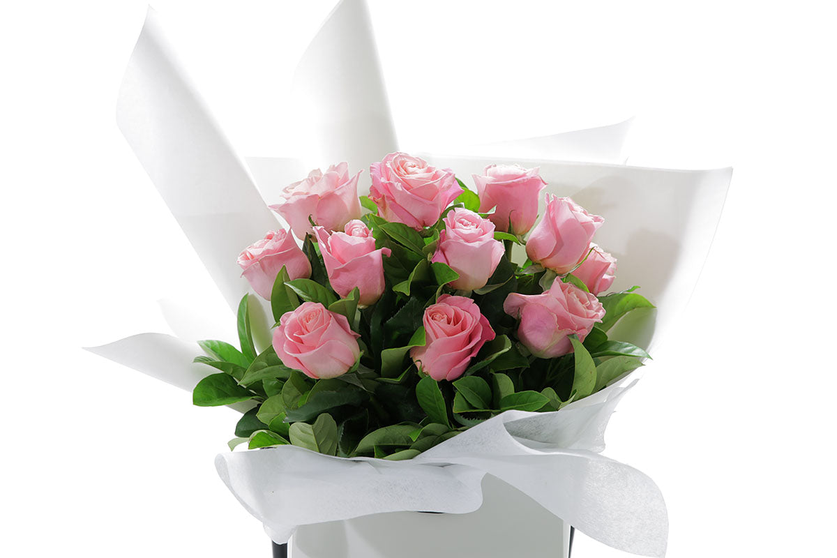 Close-up of HERMOSA bouquet with watermelon classic roses