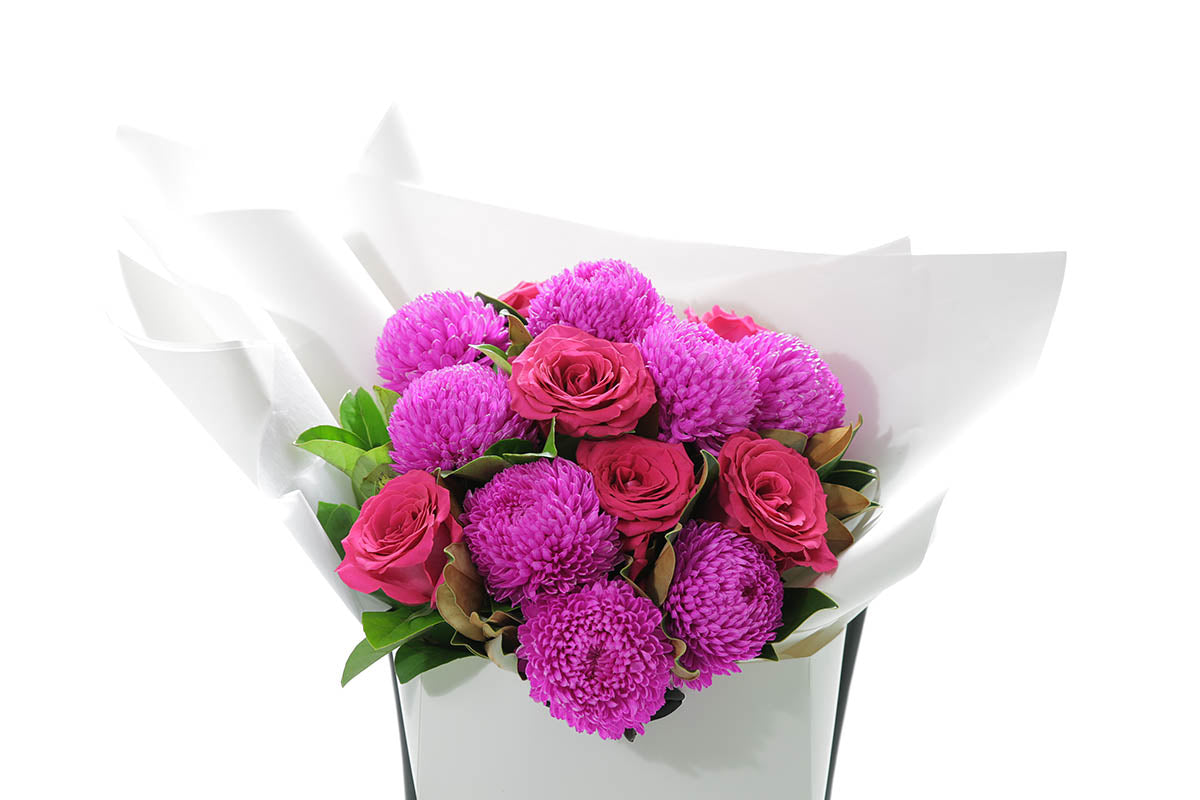Close-up of LENI extra large bouquet with hot pink and magenta seasonal blooms