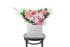 Best selling pastel pink seasonal flower bouquet displaying mixed pink flowers and green foliage. Large bouquet presented in Kate Hill Flower Bag. Bouquet features soft pink roses, phalaenopsis orchids, disbuds and lush green foliage. Bouquet bag sitting on a black bentwood chair.