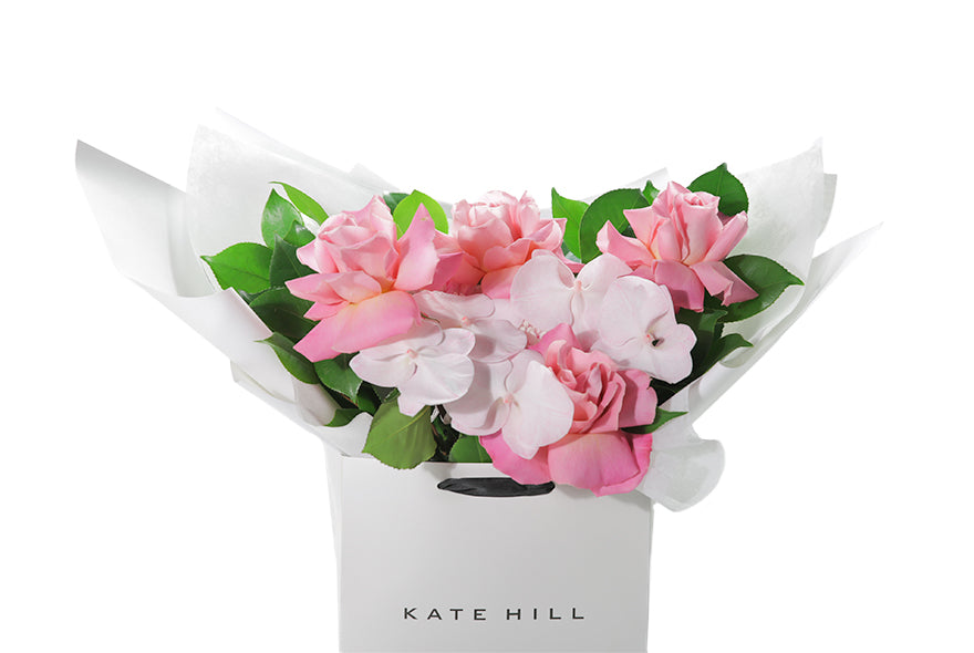 Best selling pastel pink seasonal flower bouquet displaying mixed pink flowers and green foliage. Large bouquet presented in Kate Hill Flower Bag. Up close image of the large bouquet showing the quality and whats in the flower bouquet.