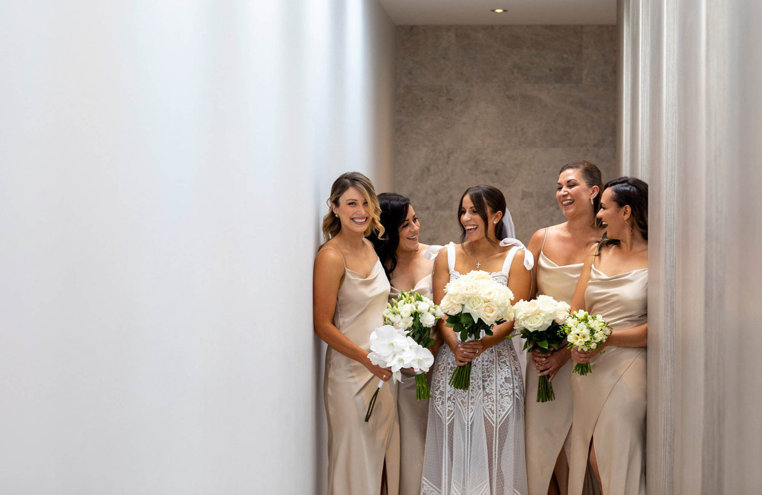 Bridal party in Melbourne all holding bridal bouquets