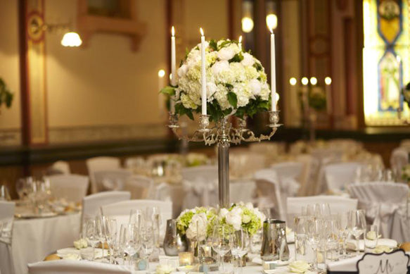 Melbourne wedding Reception decorated with flowers on classic candelabra with candles