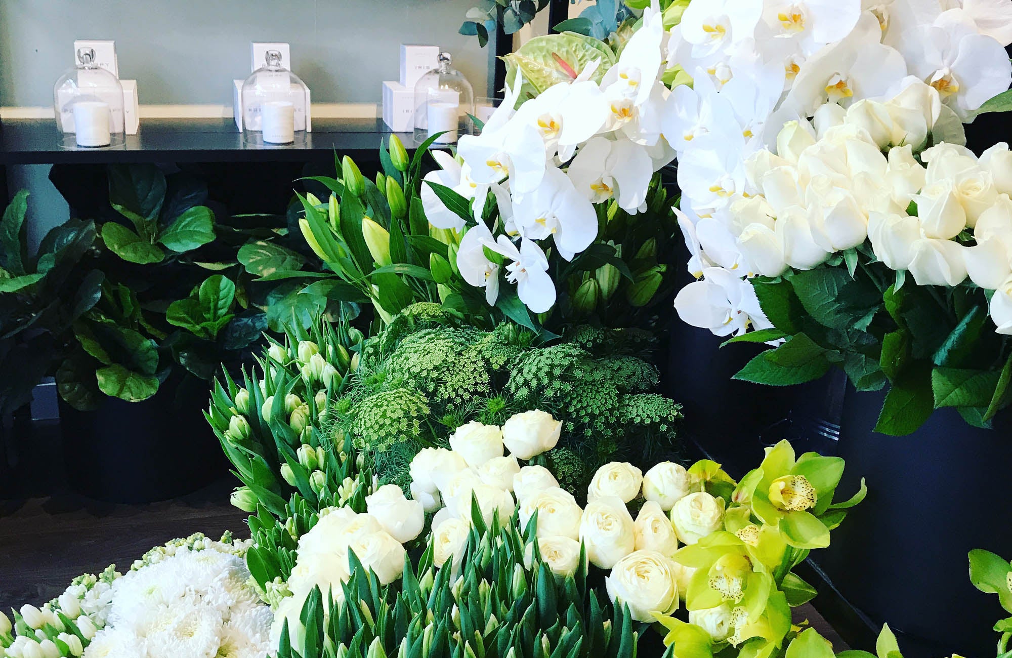 Shop display of flowers in green and white at Kate Hill Flowers in Melbourne