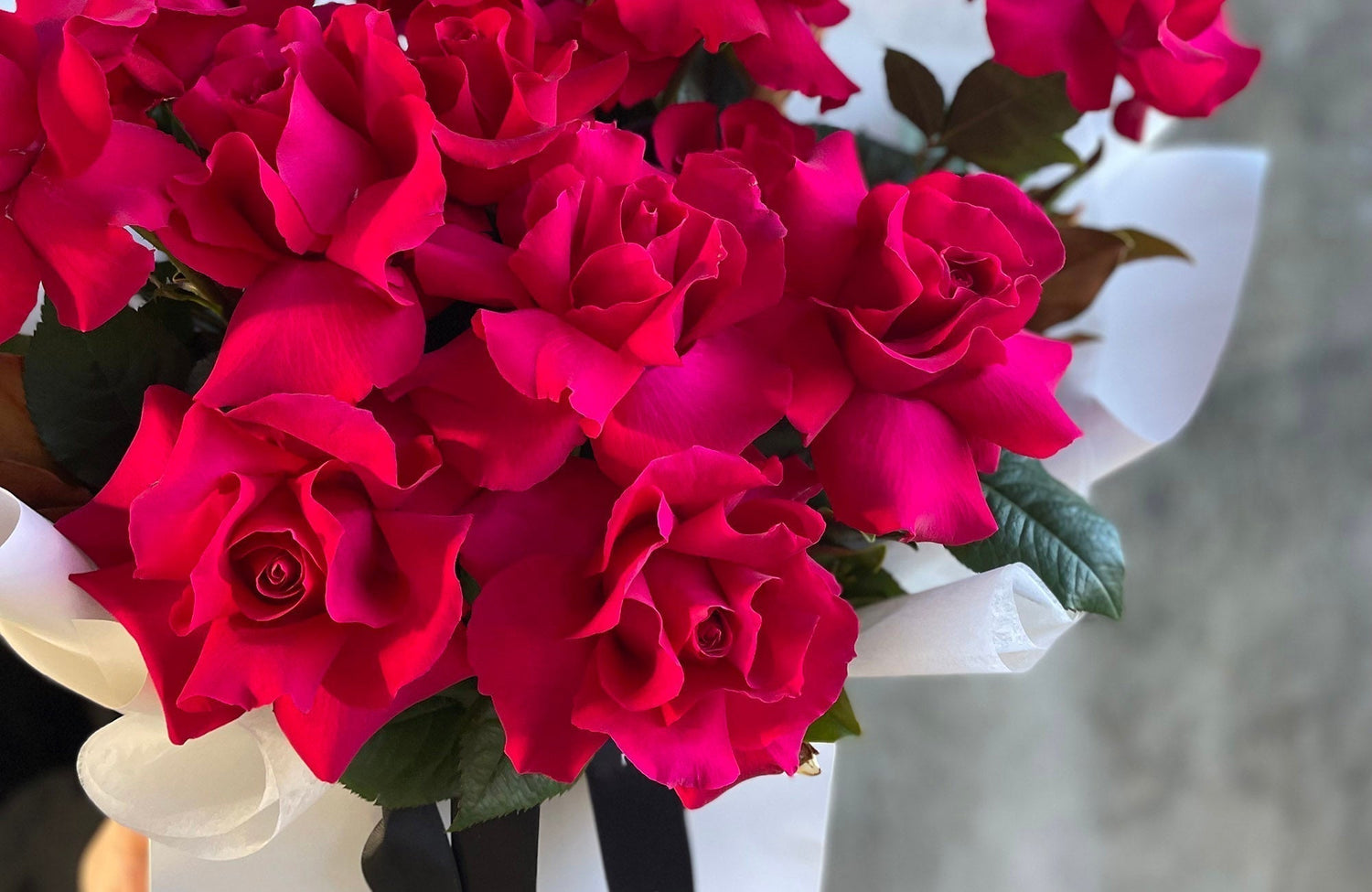 Reflexed red roses arranged in a romantic flower bouquet