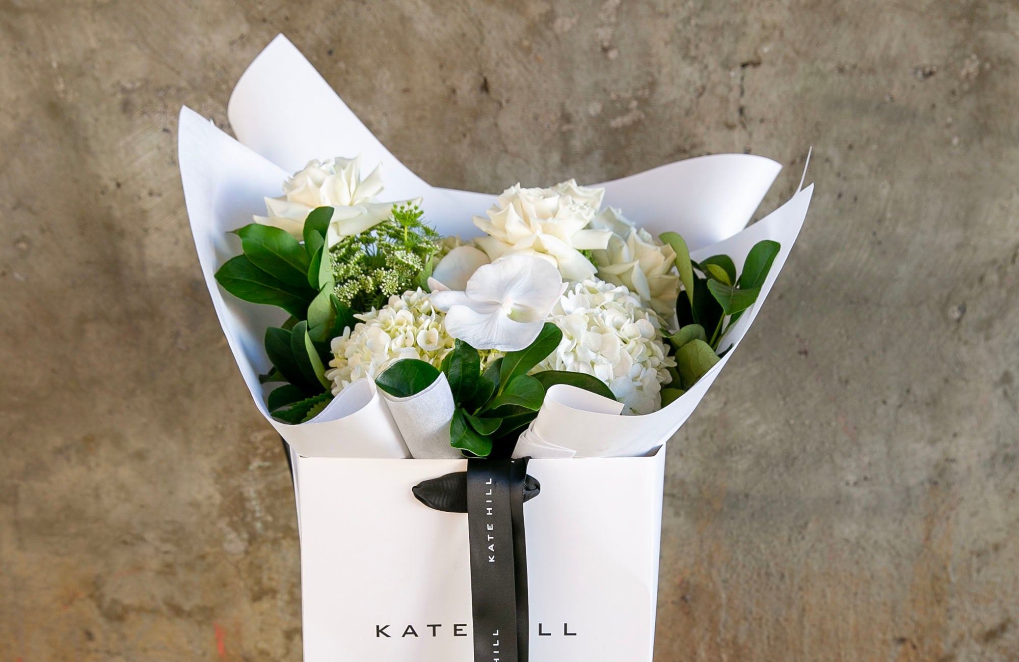 White bouquet of Sympathy Flowers for Delivery In Melbourne