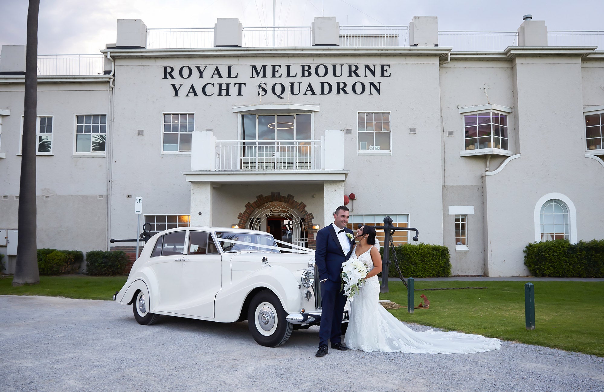 Bride and groom standing outside of Melbourne wedding venue, Harbour Room