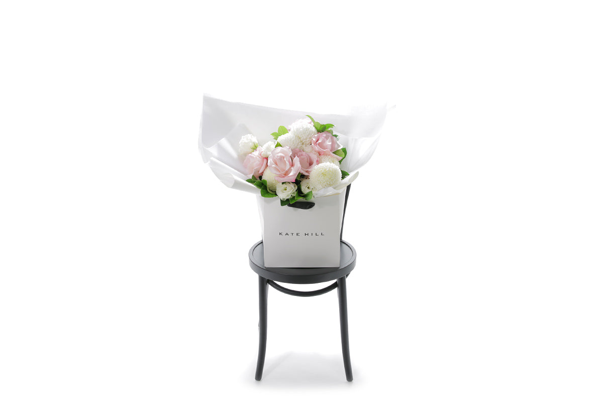 SERENITY small pastel flower bouquet in blush and white by Kate Hill Flowers Melbourne in black chair