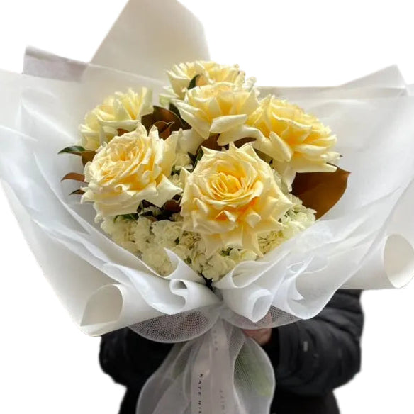 Close up image of our August Birthday Bouquet in lemon and cream tones.