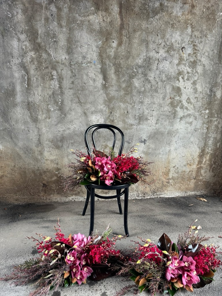 3 Tablescapes of GARNET sitting on concrete floor and black bentwood chair.