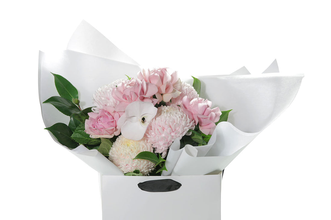 Kate Hill Flowers – medium blush and soft-pink birthday bouquet of roses, chrysanthemums and orchids, hand-tied.