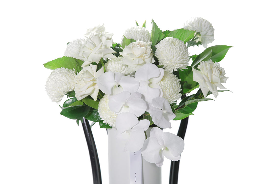 Kate Hill Flowers – large white and green ceramic vase with roses, chrysanthemums and orchids.